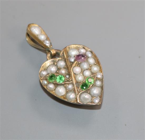 A yellow metal, green garnet, ruby and split pearl set heart shaped pendant, stamped 9ct, overall 30mm.